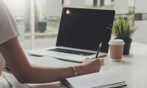 Picture of woman hand filling in invoice paper,Online Taxes And Invoice Billing Electronic